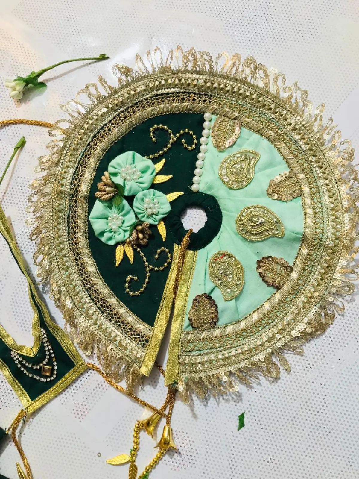 A mint green and dark green and embroidered regal laddugopal dress.